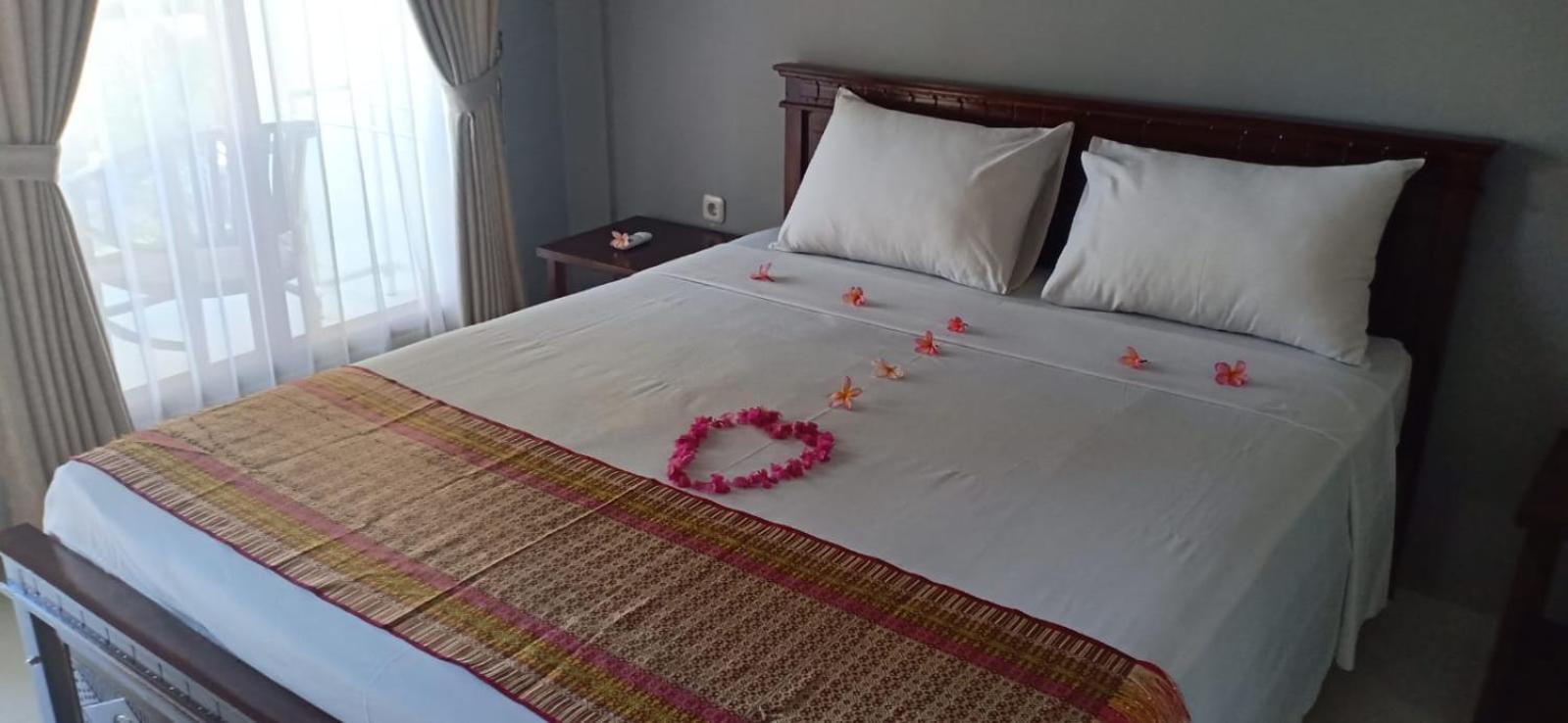 Qurnia Homestay Kuta  Bilik gambar